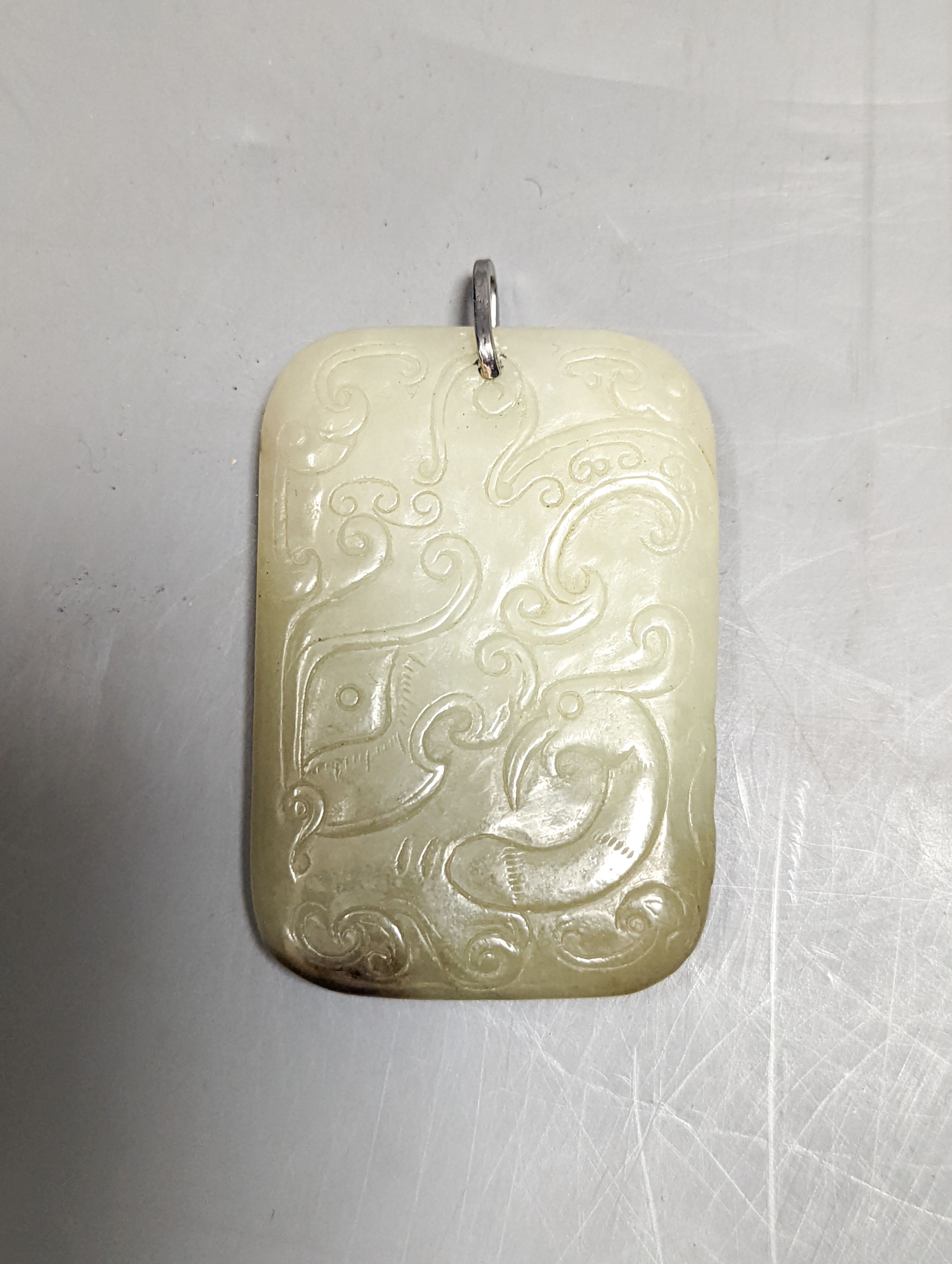 A Chinese carved jade plaque 6.5cm